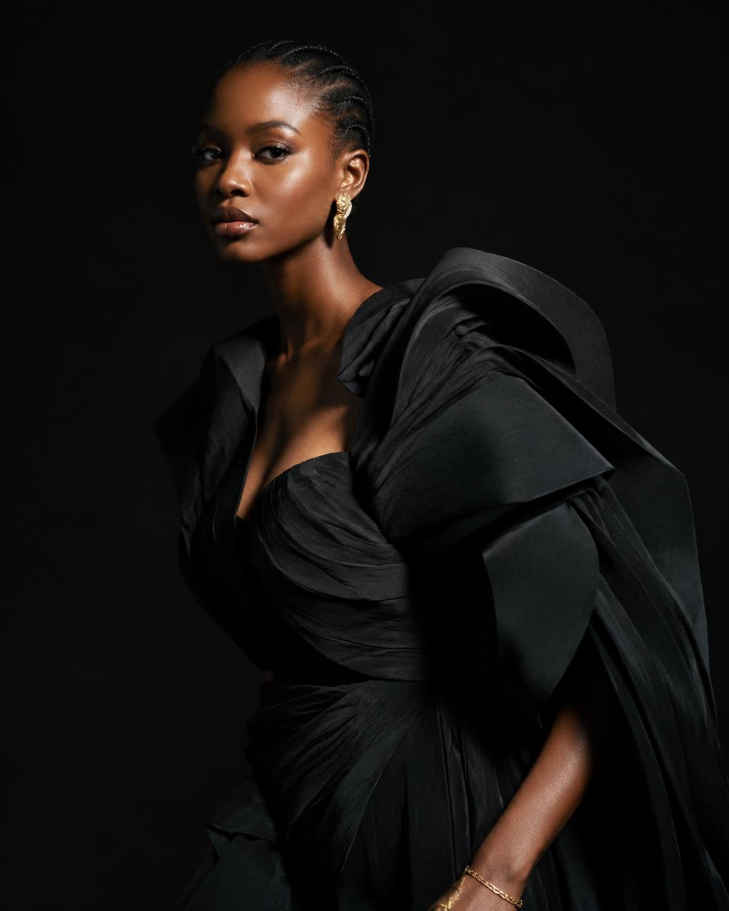 African fashion model in a sculptural black gown